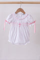 White cross smocked ruffle bubble